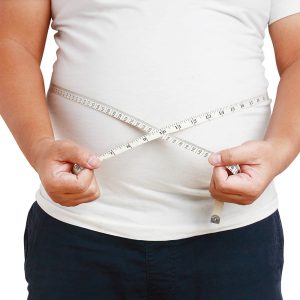 The fat man, the belly is very big, standing using the tape measure around his waist. isolated with clipping path